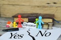 ItÃ¢â¬â¢s hard to decide whether to divorce or not with miniature toys representing a family and share goods after divorce